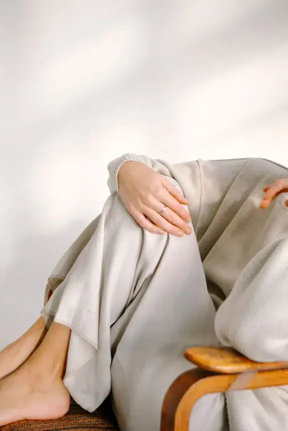 girl in fashionable clothes in a stylish light studio