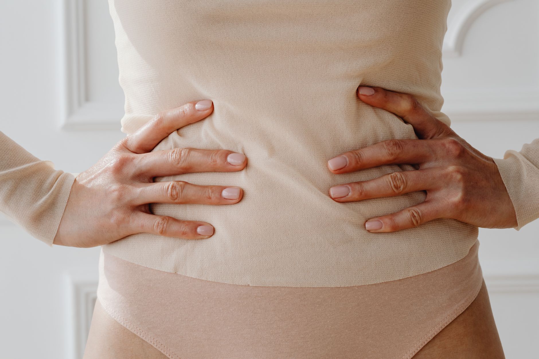 woman s hands on waist